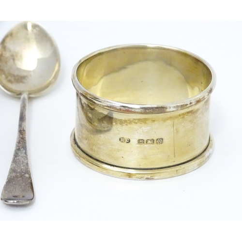 528 - A cased silver Christening set comprising egg cup, spoon and napkin ring, hallmarked Birmingham 1922... 