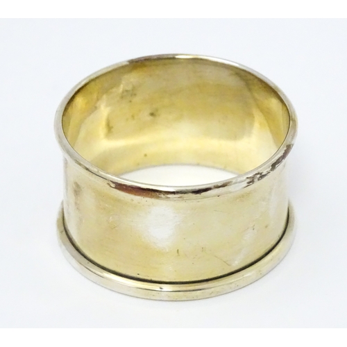 528 - A cased silver Christening set comprising egg cup, spoon and napkin ring, hallmarked Birmingham 1922... 