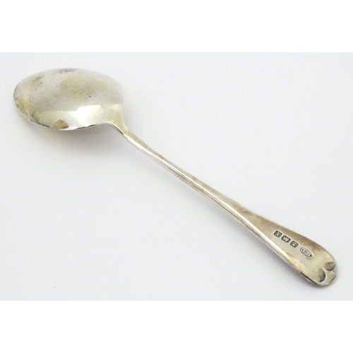 528 - A cased silver Christening set comprising egg cup, spoon and napkin ring, hallmarked Birmingham 1922... 