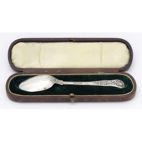 529 - A cased Victorian silver Christening spoon with fruiting vine decoration, hallmarked London 1879, ma... 