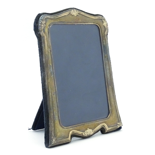535 - An easel back photograph frame with silver surround, hallmarked Sheffield 1997, make Carrs of Sheffi... 