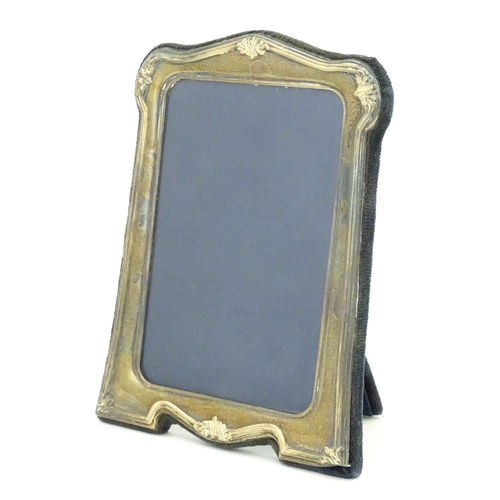 535 - An easel back photograph frame with silver surround, hallmarked Sheffield 1997, make Carrs of Sheffi... 