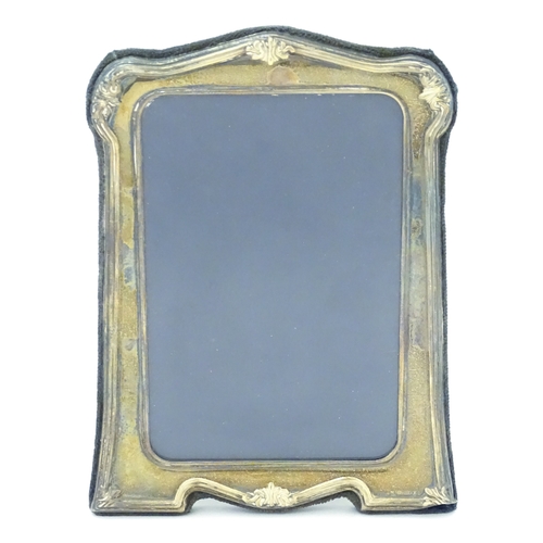 535 - An easel back photograph frame with silver surround, hallmarked Sheffield 1997, make Carrs of Sheffi... 