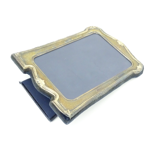 535 - An easel back photograph frame with silver surround, hallmarked Sheffield 1997, make Carrs of Sheffi... 