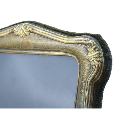 535 - An easel back photograph frame with silver surround, hallmarked Sheffield 1997, make Carrs of Sheffi... 