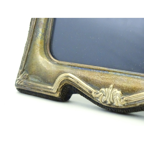 535 - An easel back photograph frame with silver surround, hallmarked Sheffield 1997, make Carrs of Sheffi... 