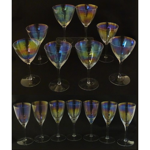 311 - Fifteen iridescent glass wine glasses. Largest approx. 7