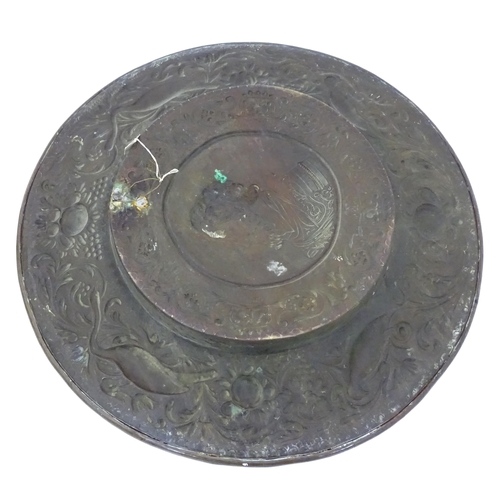 3 - A quantity of brass and copper to include a copper kettle, teapot and jug together with a large bras... 