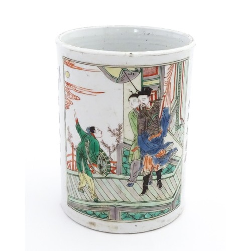 60 - A Chinese Wucai brush pot decorated with figures on a terrace, and in a landscape, with Character sc... 