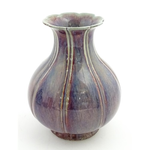 62 - A Chinese sang de boeuf vase of lobed form. Approx. 10 1/2