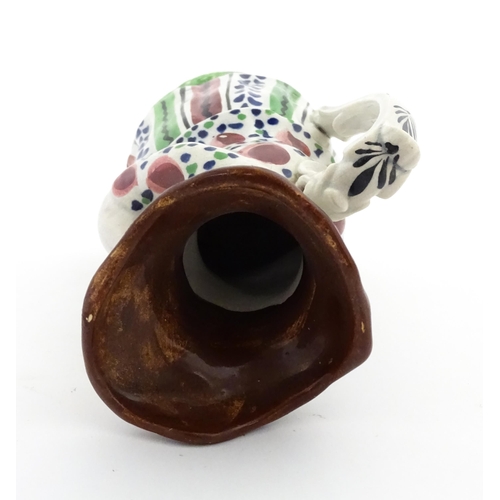 80 - A Staffordshire pottery Lady Snuff Taker Toby jug.  Approx. 9 3/4