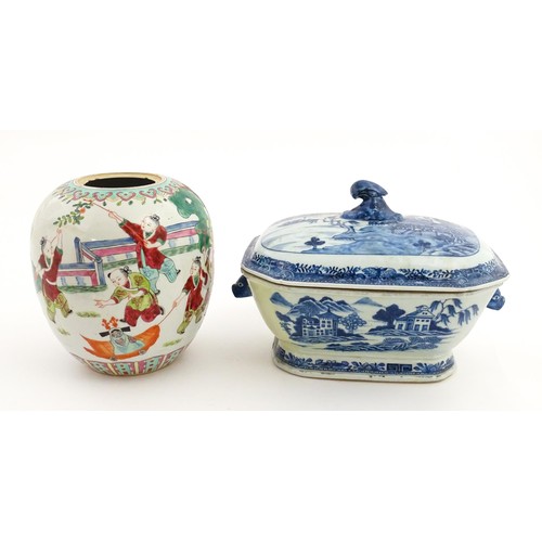 70A - An 18thC Chinese export blue and white lidded tureen decorated with a river landscape with trees and... 