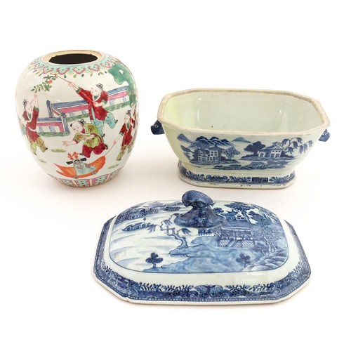 70A - An 18thC Chinese export blue and white lidded tureen decorated with a river landscape with trees and... 