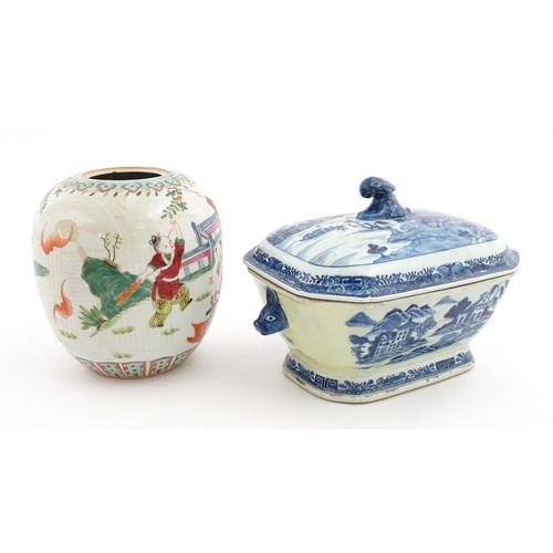 70A - An 18thC Chinese export blue and white lidded tureen decorated with a river landscape with trees and... 