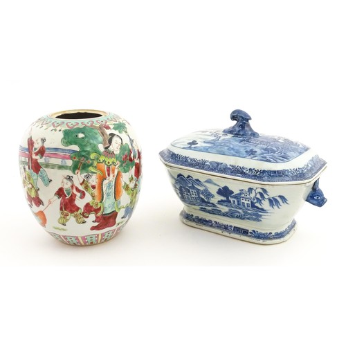 70A - An 18thC Chinese export blue and white lidded tureen decorated with a river landscape with trees and... 