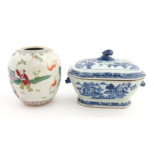 70A - An 18thC Chinese export blue and white lidded tureen decorated with a river landscape with trees and... 