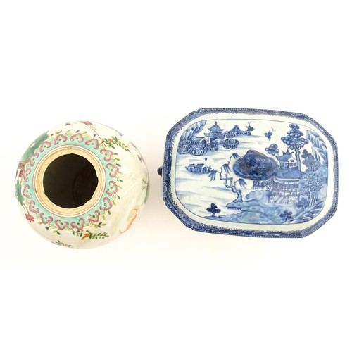 70A - An 18thC Chinese export blue and white lidded tureen decorated with a river landscape with trees and... 