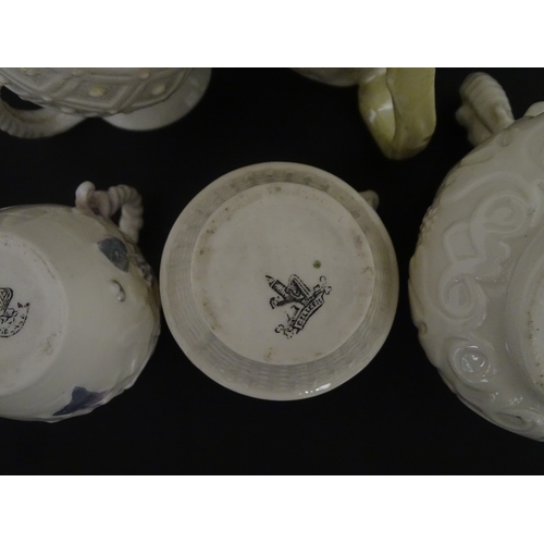 100 - Five Belleek jugs to include Institute creamer with seahorse handle, Rope Handle jug, Bacchus Mask, ... 