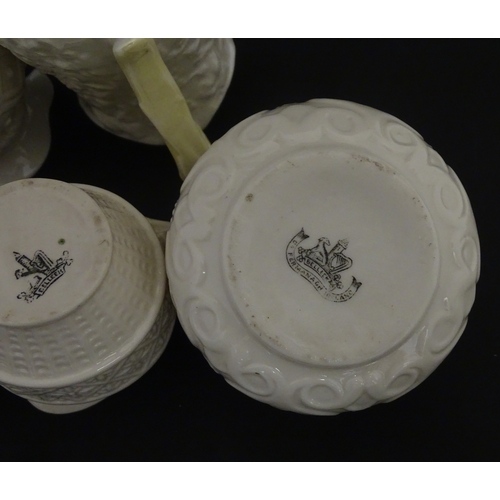 100 - Five Belleek jugs to include Institute creamer with seahorse handle, Rope Handle jug, Bacchus Mask, ... 
