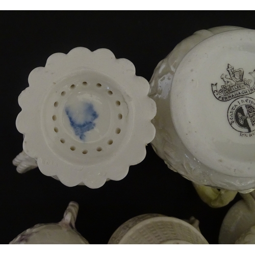 100 - Five Belleek jugs to include Institute creamer with seahorse handle, Rope Handle jug, Bacchus Mask, ... 