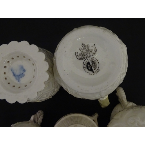 100 - Five Belleek jugs to include Institute creamer with seahorse handle, Rope Handle jug, Bacchus Mask, ... 