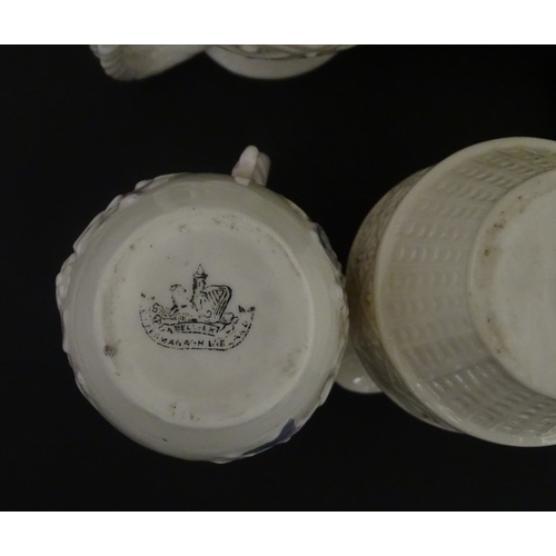 100 - Five Belleek jugs to include Institute creamer with seahorse handle, Rope Handle jug, Bacchus Mask, ... 