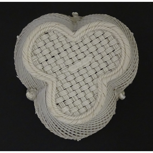 101 - Two Belleek three strand baskets of shamrock form with applied flower and leaf detail to rim. Both w... 