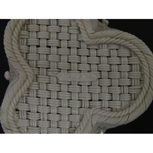 101 - Two Belleek three strand baskets of shamrock form with applied flower and leaf detail to rim. Both w... 
