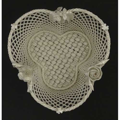 101 - Two Belleek three strand baskets of shamrock form with applied flower and leaf detail to rim. Both w... 
