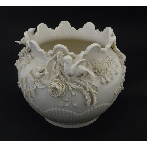 103 - A Belleek Rathmore jardiniere / planter decorated with birds, flowers and foliage. Marked with Secon... 