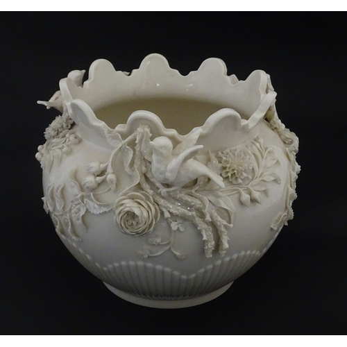 103 - A Belleek Rathmore jardiniere / planter decorated with birds, flowers and foliage. Marked with Secon... 