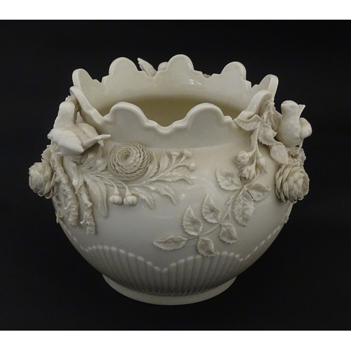 103 - A Belleek Rathmore jardiniere / planter decorated with birds, flowers and foliage. Marked with Secon... 