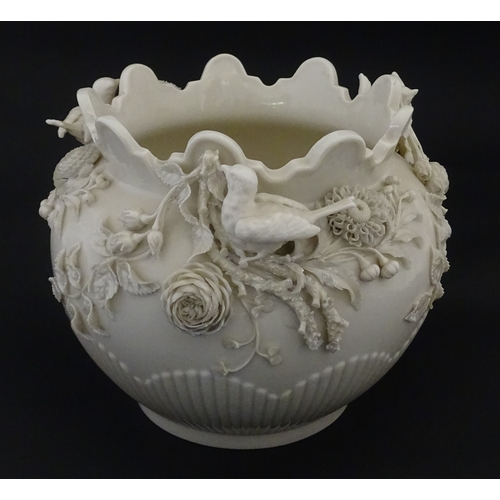103 - A Belleek Rathmore jardiniere / planter decorated with birds, flowers and foliage. Marked with Secon... 