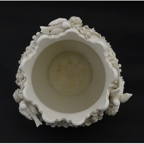 103 - A Belleek Rathmore jardiniere / planter decorated with birds, flowers and foliage. Marked with Secon... 