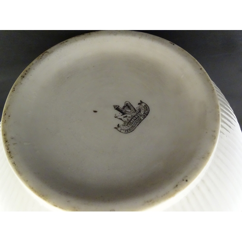 103 - A Belleek Rathmore jardiniere / planter decorated with birds, flowers and foliage. Marked with Secon... 
