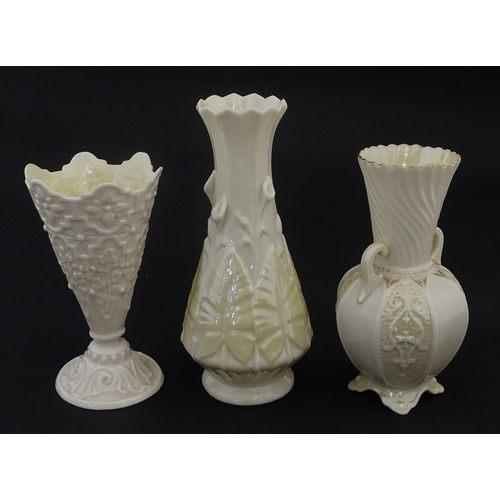 106 - Three Belleek vases to include a small Calla Lily Nile vase, a Shamrock spill vase of conical form, ... 