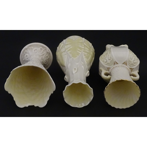 106 - Three Belleek vases to include a small Calla Lily Nile vase, a Shamrock spill vase of conical form, ... 
