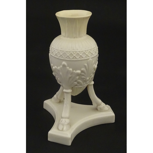 107 - A Belleek Amphora vase on tripod support with hoof feet. Bearing First Period mark under. Approx. 6 ... 