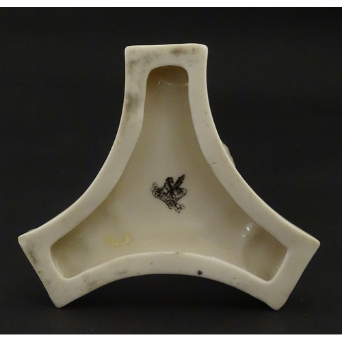 107 - A Belleek Amphora vase on tripod support with hoof feet. Bearing First Period mark under. Approx. 6 ... 