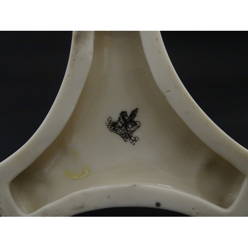 107 - A Belleek Amphora vase on tripod support with hoof feet. Bearing First Period mark under. Approx. 6 ... 