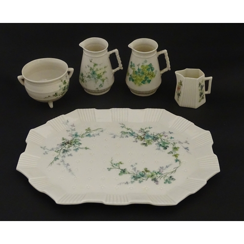 108 - Five items of Belleek porcelain decorated with hand painted shamrock detail to include a sugar bowl,... 