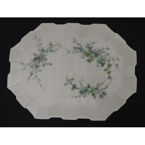 108 - Five items of Belleek porcelain decorated with hand painted shamrock detail to include a sugar bowl,... 
