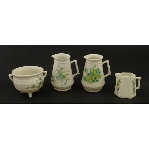 108 - Five items of Belleek porcelain decorated with hand painted shamrock detail to include a sugar bowl,... 