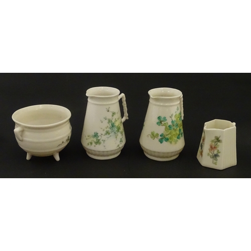 108 - Five items of Belleek porcelain decorated with hand painted shamrock detail to include a sugar bowl,... 
