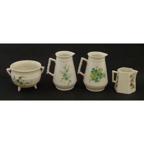 108 - Five items of Belleek porcelain decorated with hand painted shamrock detail to include a sugar bowl,... 