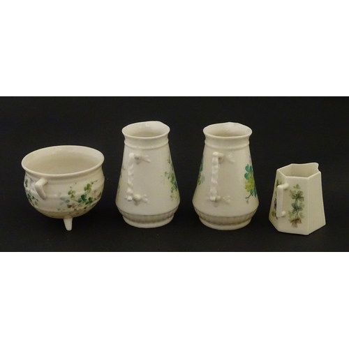108 - Five items of Belleek porcelain decorated with hand painted shamrock detail to include a sugar bowl,... 