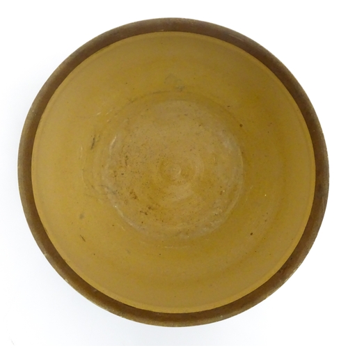 111 - A Doulton Lambeth stoneware bowl decorated with scrolling foliate detail and banded decoration. Mark... 