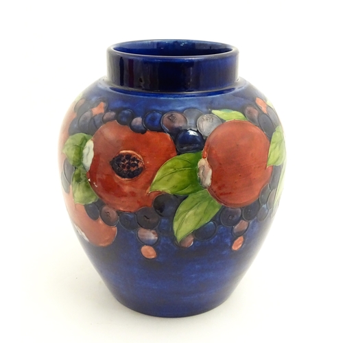 112 - A Moorcroft ginger jar decorated in the Pomegranate pattern. Marked under. Approx. 9 3/4