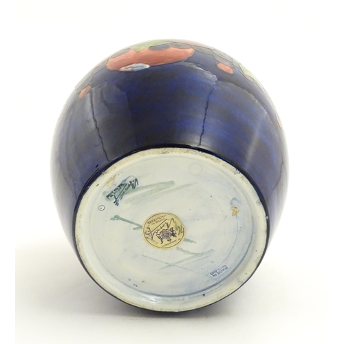 112 - A Moorcroft ginger jar decorated in the Pomegranate pattern. Marked under. Approx. 9 3/4