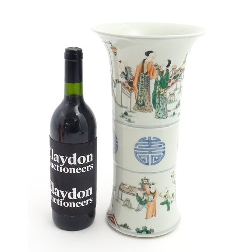 57 - A Chinese famille verte vase of Gu form decorated with figures, children playing and flying kites. A... 